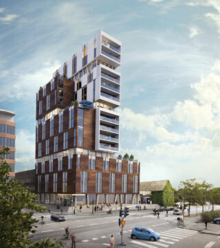 Visionsbilden visar en modern byggnad med fasad i mörkt trä och vitt på de övre delarna. Kommunhuset som ligger på de nedra våningarna har höga fönster och hotellet som ligger på de övre våningarna har generösa balkonger som vetter mot gatan.